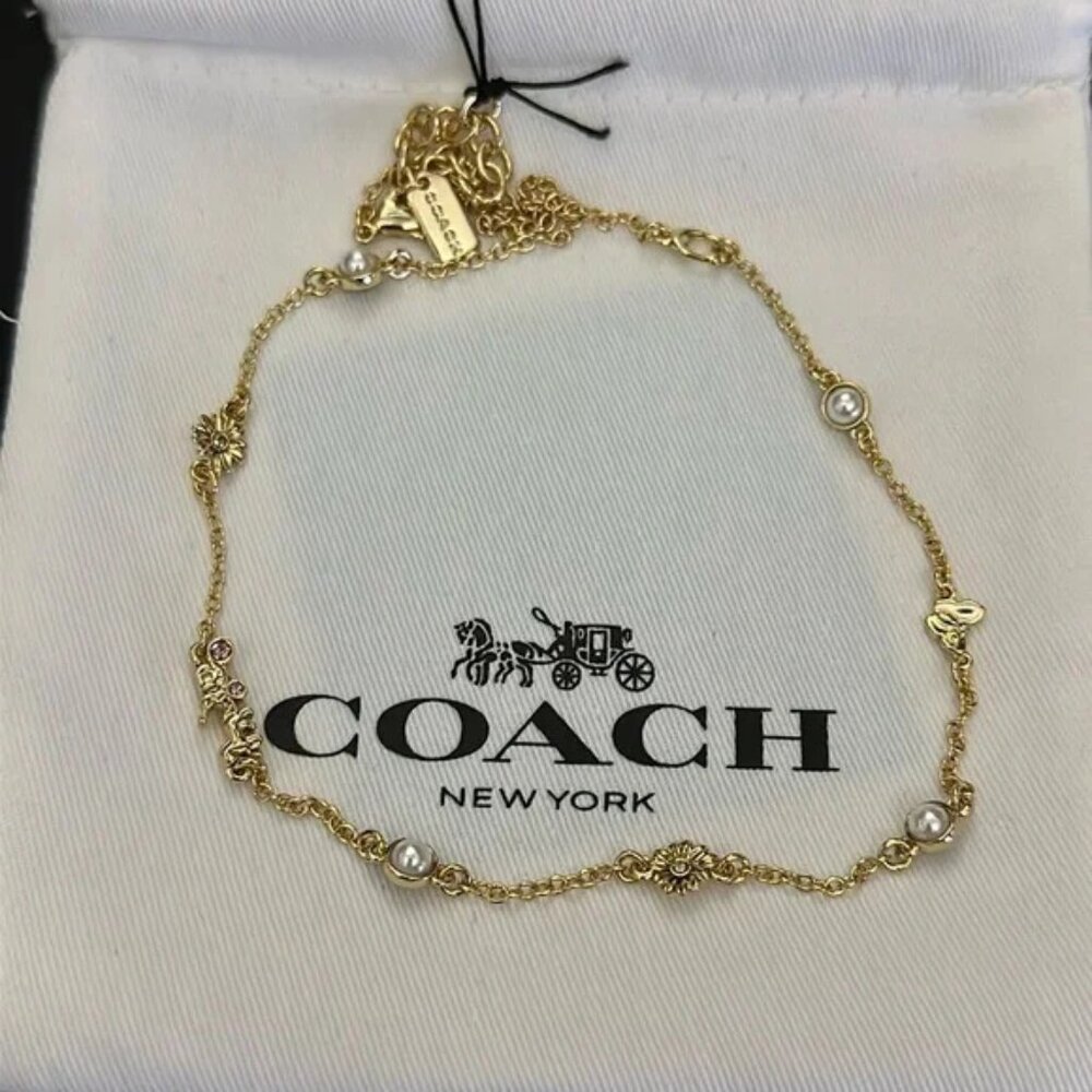Coach gold necklace